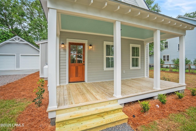 9 Attaway Ln, Beaufort, SC 29907 - property entrance with a garage, a porch, and fence