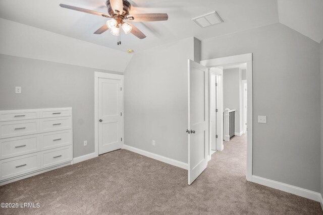 9 Attaway Ln, Beaufort, SC 29907 - unfurnished bedroom with lofted ceiling, light colored carpet, baseboards, and ceiling fan