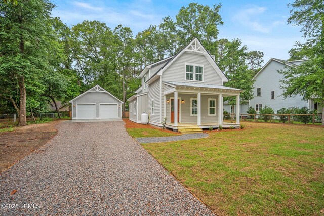 9 Attaway Ln, Beaufort, SC 29907 - view of front of house with an outdoor structure, a garage, and a porch