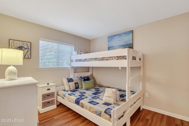 bedroom with hardwood / wood-style floors