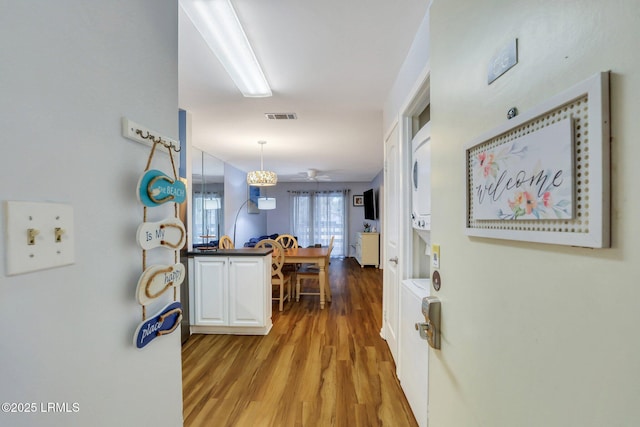 corridor featuring light hardwood / wood-style flooring