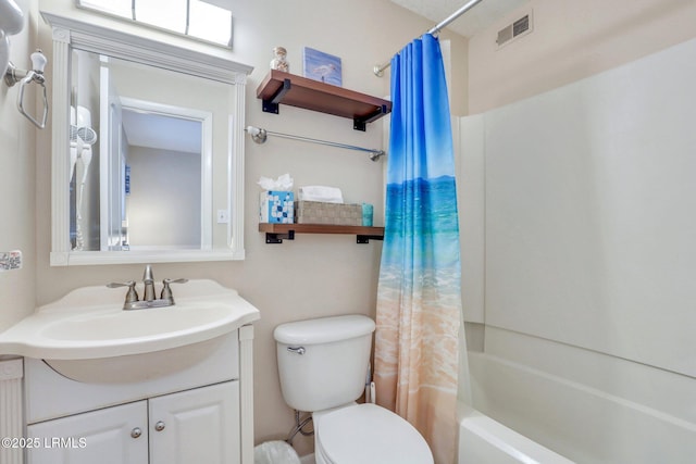 full bathroom featuring vanity, shower / tub combo, and toilet