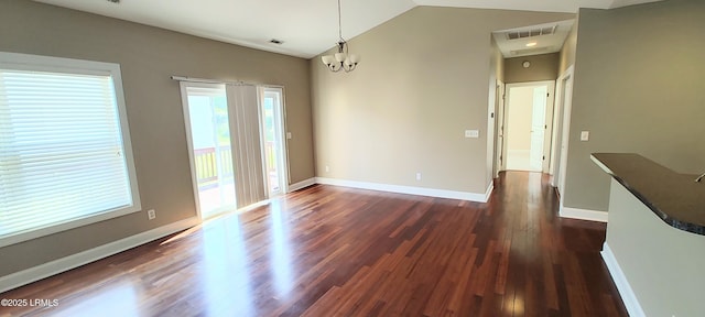 25 Kings Cross Ct, Beaufort, SC 29902 - unfurnished room with vaulted ceiling, dark wood-type flooring, a chandelier, and baseboards