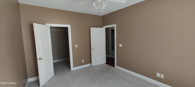 25 Kings Cross Ct, Beaufort, SC 29902 - unfurnished bedroom with carpet, baseboards, a walk in closet, a closet, and ceiling fan