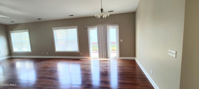 25 Kings Cross Ct, Beaufort, SC 29902 - unfurnished room with wood finished floors, a chandelier, and baseboards
