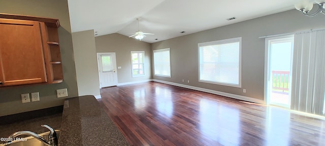 25 Kings Cross Ct, Beaufort, SC 29902 - unfurnished living room with a ceiling fan, dark wood-type flooring, vaulted ceiling, and baseboards
