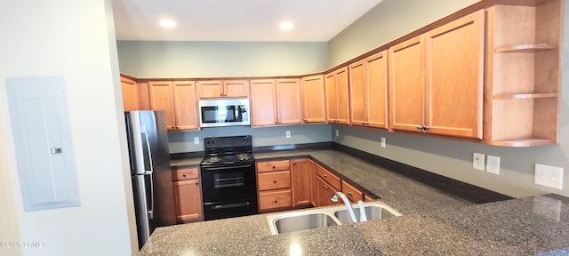 25 Kings Cross Ct, Beaufort, SC 29902 - kitchen with stainless steel appliances, open shelves, a sink, electric panel, and dark stone countertops
