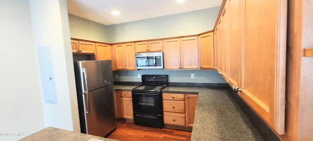 25 Kings Cross Ct, Beaufort, SC 29902 - kitchen featuring appliances with stainless steel finishes, dark countertops, dark wood-style floors, light brown cabinets, and recessed lighting