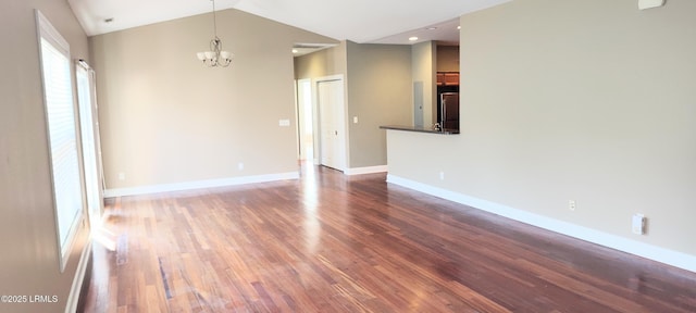 25 Kings Cross Ct, Beaufort, SC 29902 - empty room featuring a chandelier, wood finished floors, vaulted ceiling, baseboards, and recessed lighting