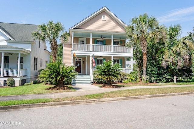 view of front of home with a ceiling fan, a porch, and a balcony