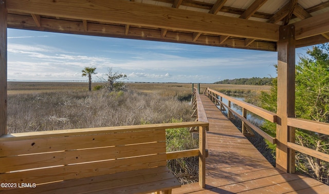 view of dock with a rural view