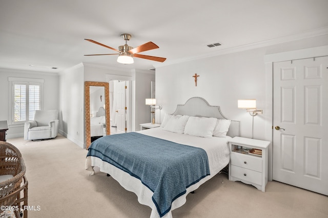 bedroom featuring visible vents, ornamental molding, a ceiling fan, and light colored carpet