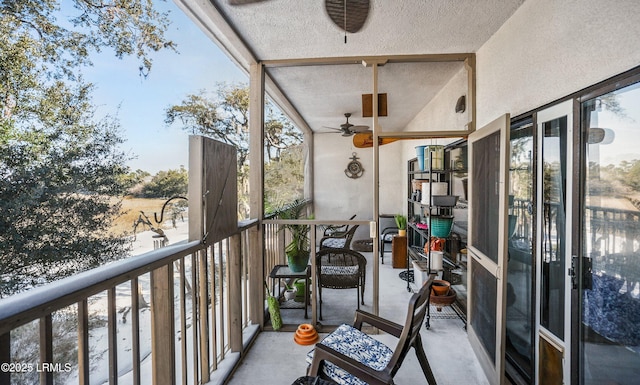 sunroom featuring ceiling fan