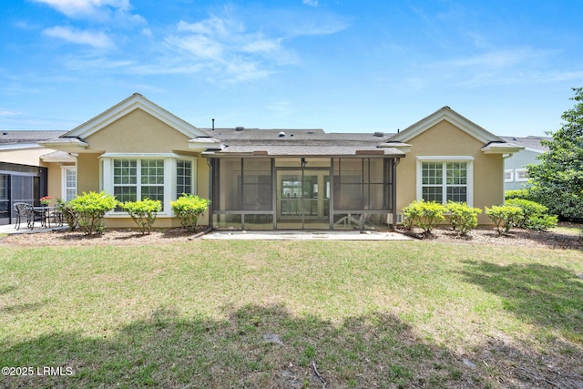 346 Landing Ln, Bluffton, SC 29909 - back of property featuring a sunroom, stucco siding, and a yard