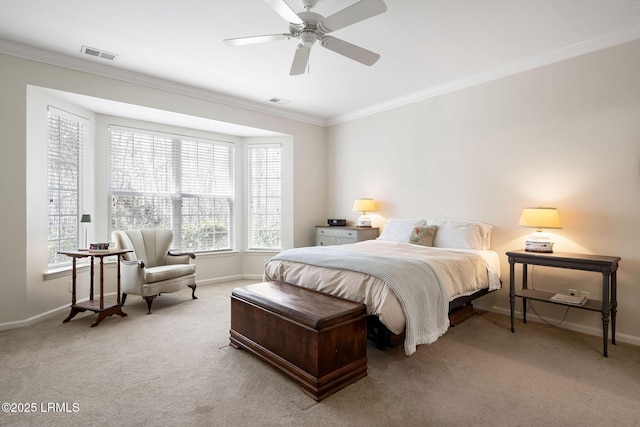 carpeted bedroom with crown molding, baseboards, and visible vents