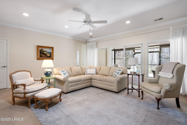 living room with visible vents, recessed lighting, ornamental molding, ceiling fan, and light colored carpet