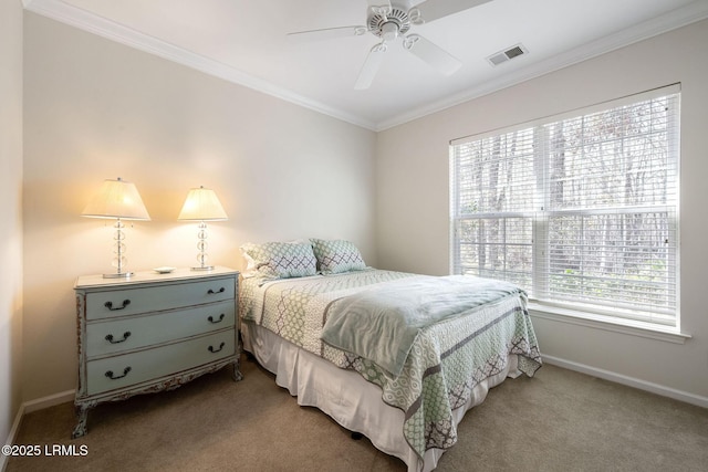 bedroom featuring visible vents, carpet flooring, crown molding, baseboards, and ceiling fan