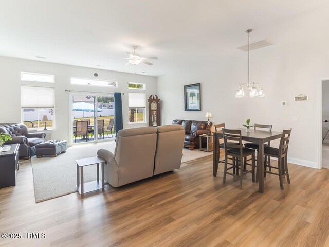 1872 Hearthstone Lake Dr, Ridgeland, SC 29936 - living area featuring a ceiling fan, light wood finished floors, and a chandelier
