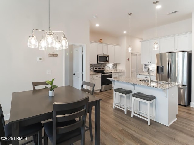 1872 Hearthstone Lake Dr, Ridgeland, SC 29936 - dining space with dark wood-style flooring and recessed lighting