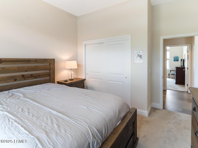 1872 Hearthstone Lake Dr, Ridgeland, SC 29936 - bedroom featuring light carpet, baseboards, and a closet