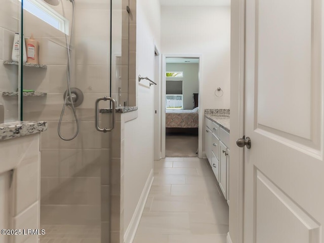 1872 Hearthstone Lake Dr, Ridgeland, SC 29936 - ensuite bathroom with healthy amount of natural light, a shower stall, vanity, and baseboards