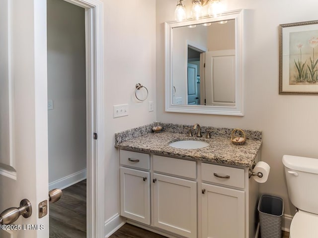 1872 Hearthstone Lake Dr, Ridgeland, SC 29936 - bathroom with vanity, toilet, wood finished floors, and baseboards