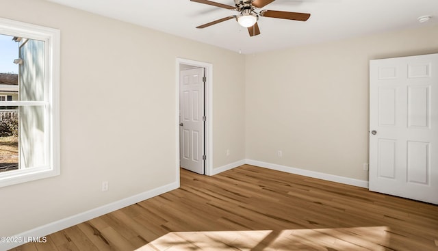 416 Meritta Ave, Beaufort, SC 29902 - unfurnished bedroom with wood finished floors, ceiling fan, and baseboards