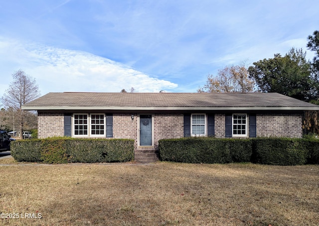 ranch-style house with a front lawn