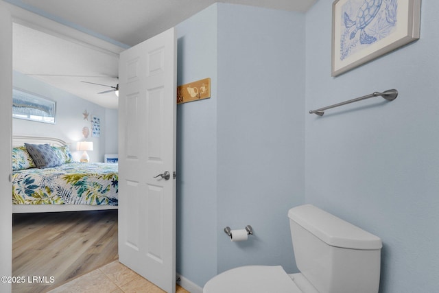 bathroom featuring tile patterned flooring, ceiling fan, and toilet