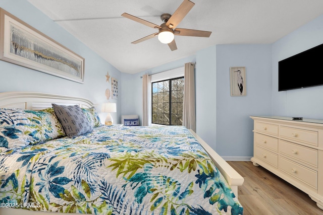 bedroom featuring ceiling fan and light wood-type flooring