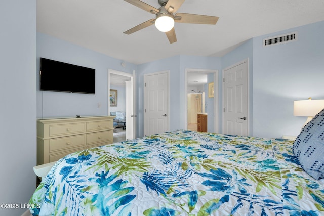 bedroom featuring ceiling fan and ensuite bathroom