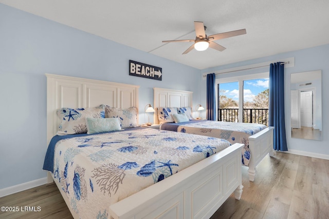 bedroom with access to exterior, light hardwood / wood-style flooring, and ceiling fan