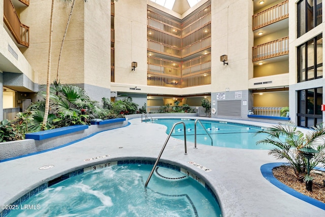 view of pool featuring a community hot tub