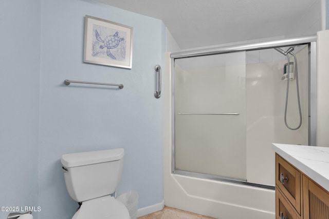 full bathroom with vanity, toilet, and combined bath / shower with glass door