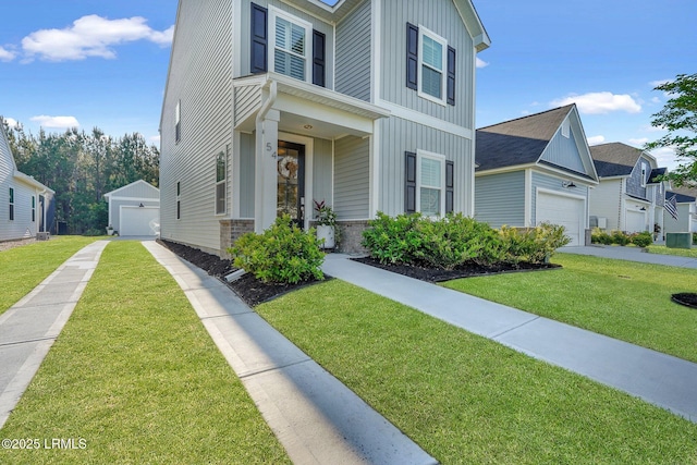 traditional-style home featuring board and batten siding, a front yard, and concrete driveway