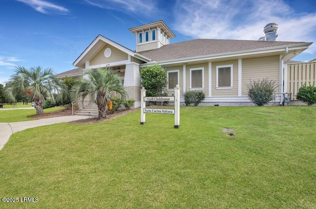view of front of home featuring roof with shingles, concrete driveway, and a front lawn