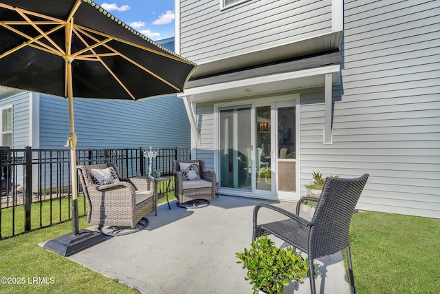 view of patio featuring fence