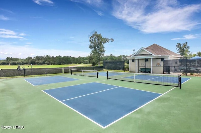 view of sport court with community basketball court and fence