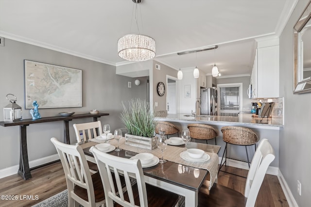 21 S Forest Beach Dr Unit 210, Hilton Head Island, SC 29928 - dining area featuring wood finished floors, a chandelier, and crown molding