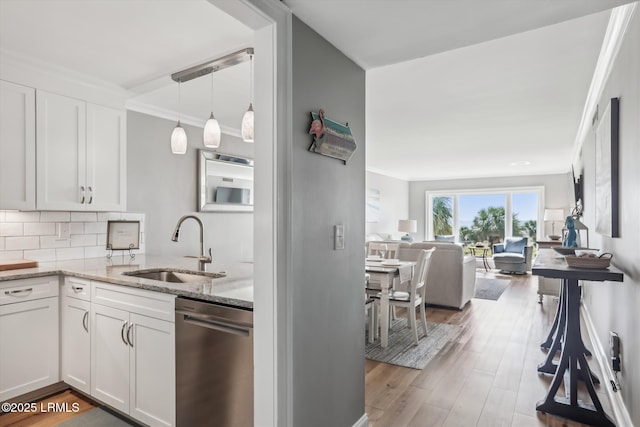 21 S Forest Beach Dr Unit 210, Hilton Head Island, SC 29928 - kitchen with dishwasher, light stone counters, open floor plan, white cabinets, and backsplash