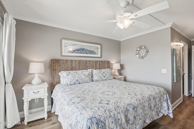 21 S Forest Beach Dr Unit 210, Hilton Head Island, SC 29928 - bedroom featuring crown molding, wood finished floors, and a ceiling fan