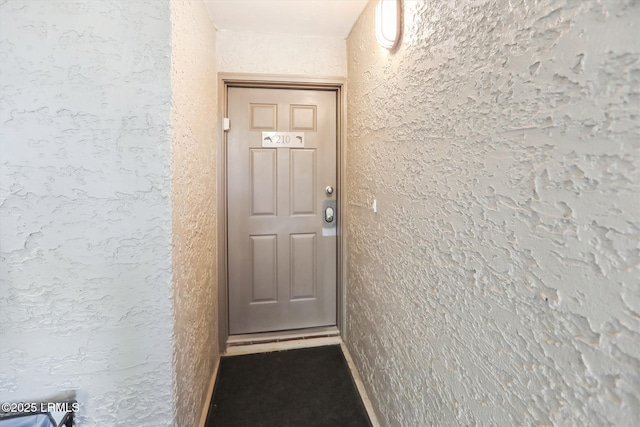 21 S Forest Beach Dr Unit 210, Hilton Head Island, SC 29928 - view of exterior entry with stucco siding