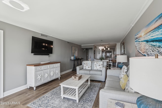 21 S Forest Beach Dr Unit 210, Hilton Head Island, SC 29928 - living room with wood finished floors and ornamental molding