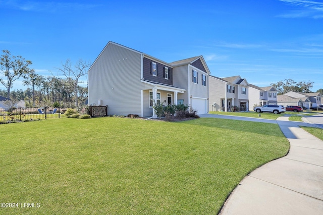 view of front of house featuring a garage and a front yard