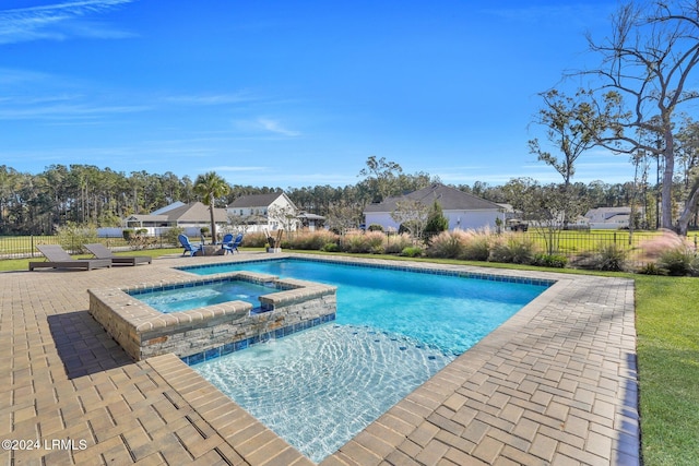 view of pool featuring an in ground hot tub and a patio