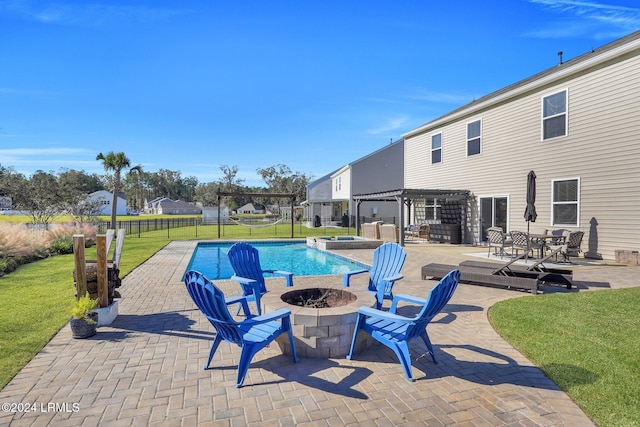 view of swimming pool with a fire pit, a yard, a pergola, and a patio