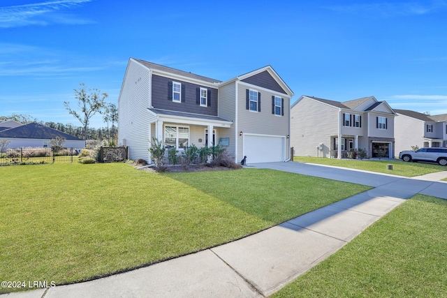 view of front of property with a garage and a front lawn