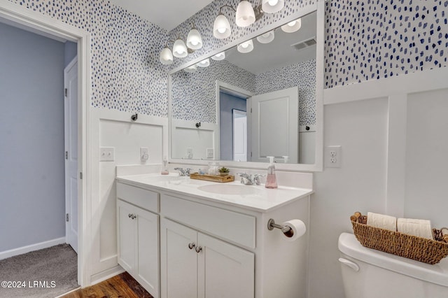 bathroom with vanity and toilet