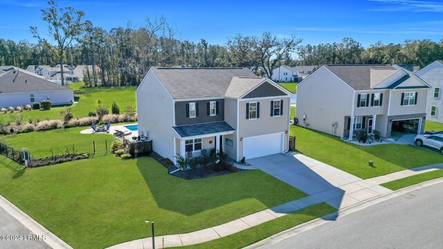 view of front facade with a garage and a front lawn