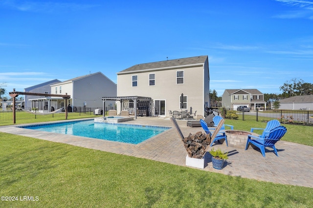 view of swimming pool featuring a fire pit, a pergola, a lawn, and a patio area